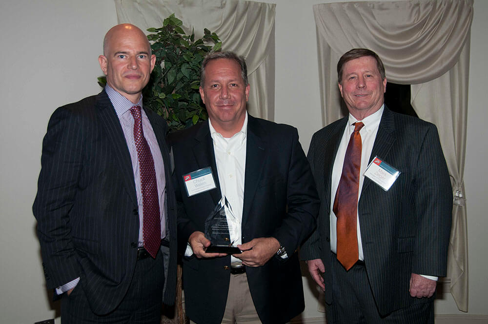 Satellite Shelters, Inc. accepts award for Outstanding Service and Quality