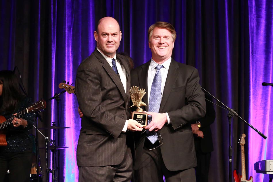 Tom Hardiman, MBI and Todd Hilde, Satellite Shelters, Inc. posing with Al Hilde's Hall of Fame Award