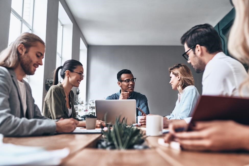 A group of business people having a meeting in a mobile office.