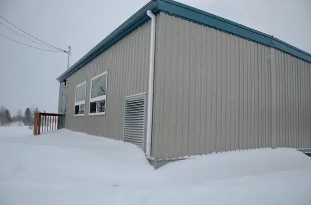 Modular building covered in snow.
