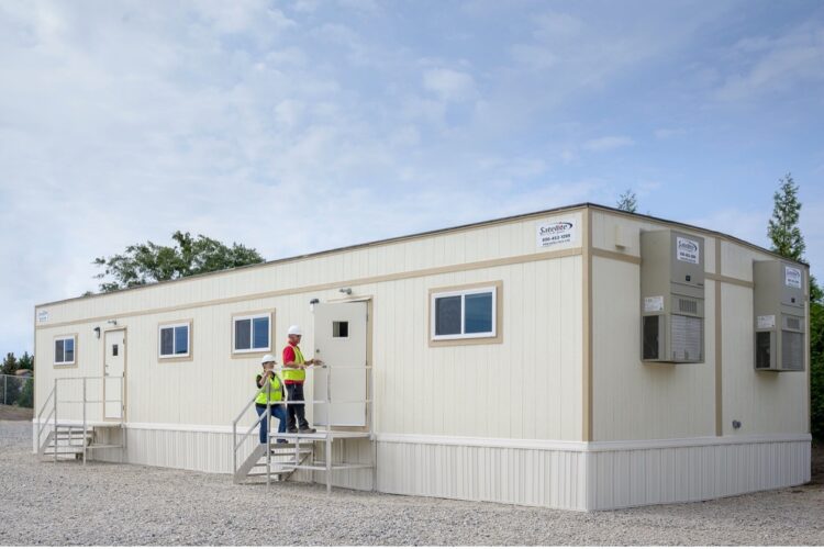 Workers at a modular building.
