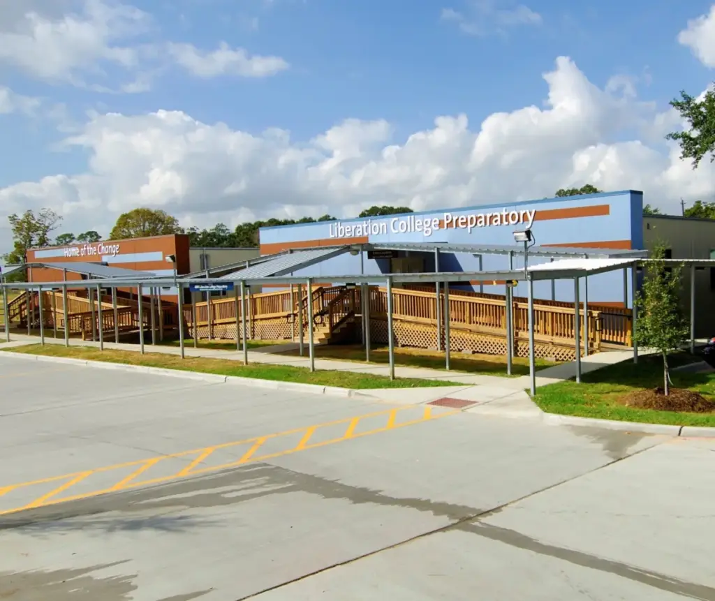 exterior of modular educational building with sidewalk awning and wooden access ramps