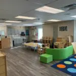 interior modular daycare facility preschool childcare room with table and chairs