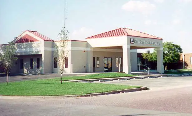 exterior of modular medical building with portico and blue skies