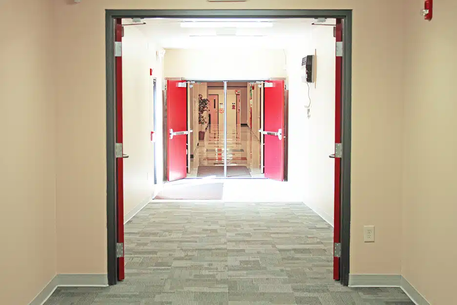 Hallway of a portable classroom with doors open