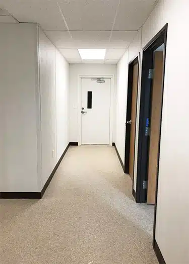 hallway white walls tan carpet