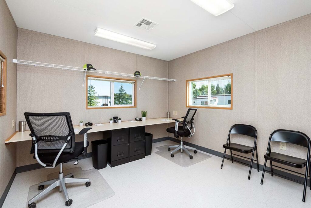 Interior mobile construction office with furniture package (desks, chairs, shelves)