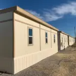 Exterior of attached mobile offices in trailer city at sunset