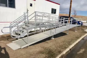 Steps and a ramp up to the door of a mobile office