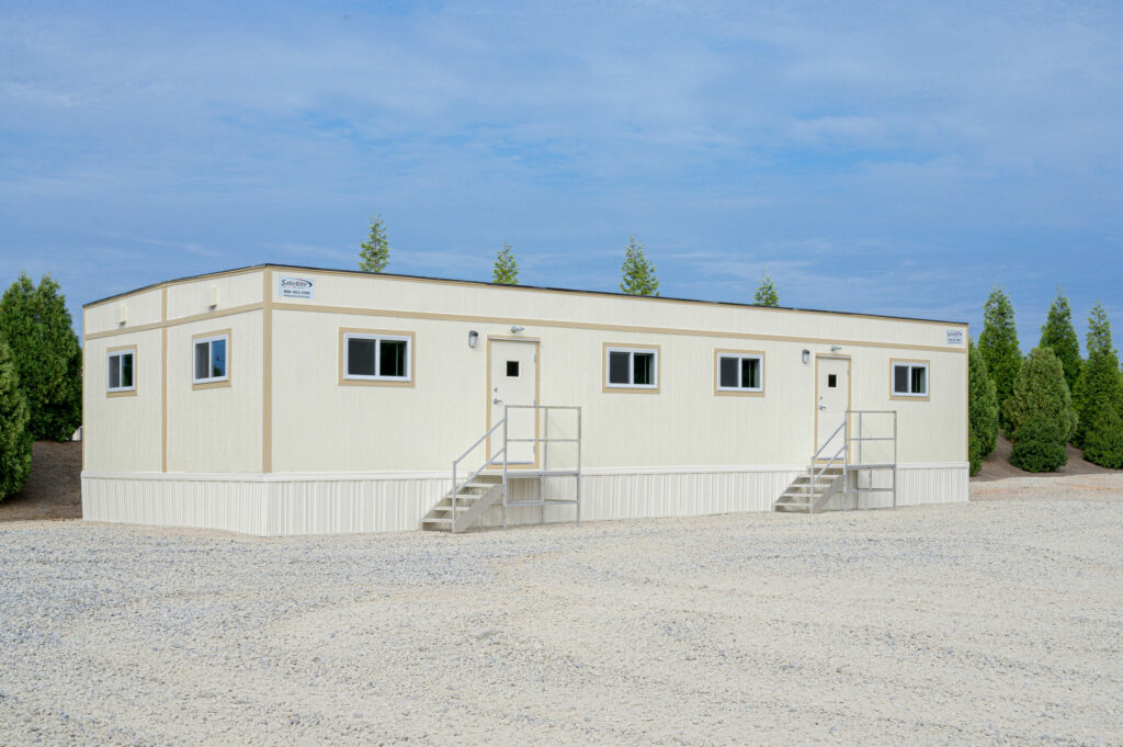 Prefabricated buildings at a construction site.