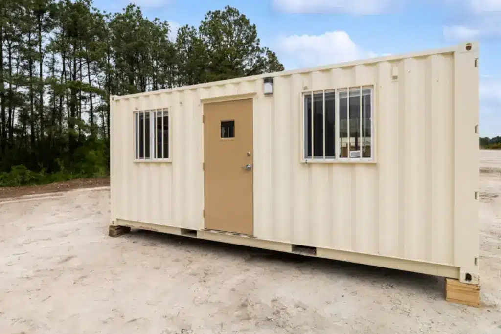 8 x 20 ground level office front view with a door and 2 windows with window bars.