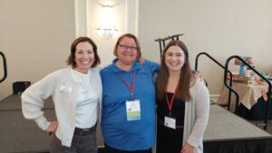 3 employees gathering at women in construction event