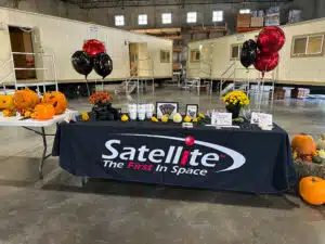Table with items in front of two mobile offices.