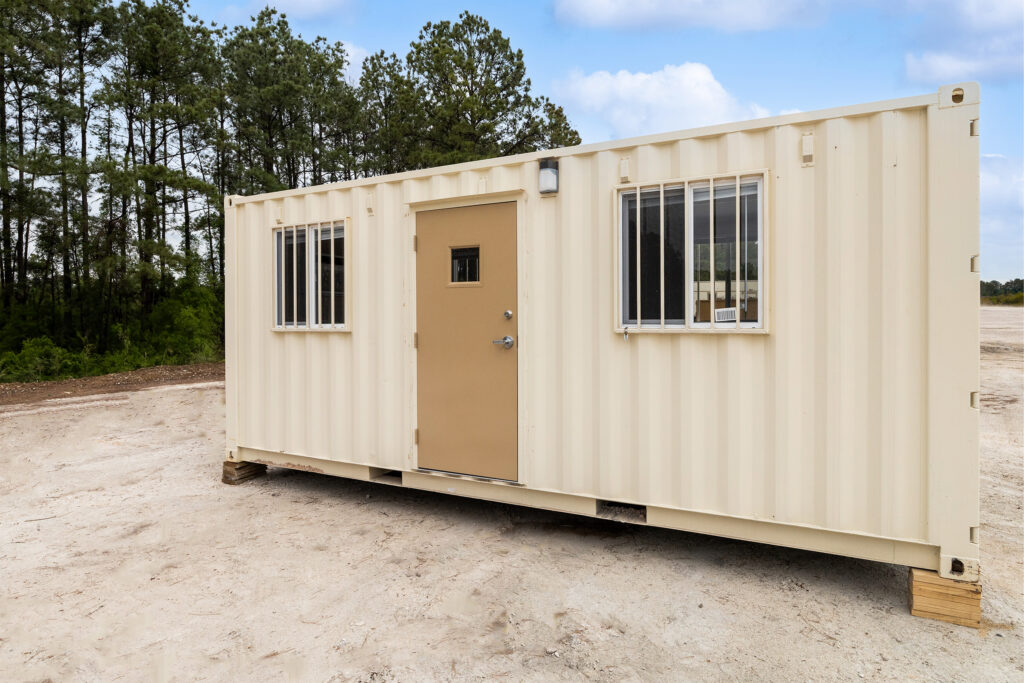 8 x 20 ground level office front view with a door and 2 windows with window bars.