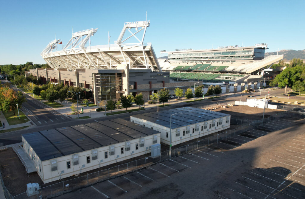 7-plex modular building aerial view with a stadium in the background.