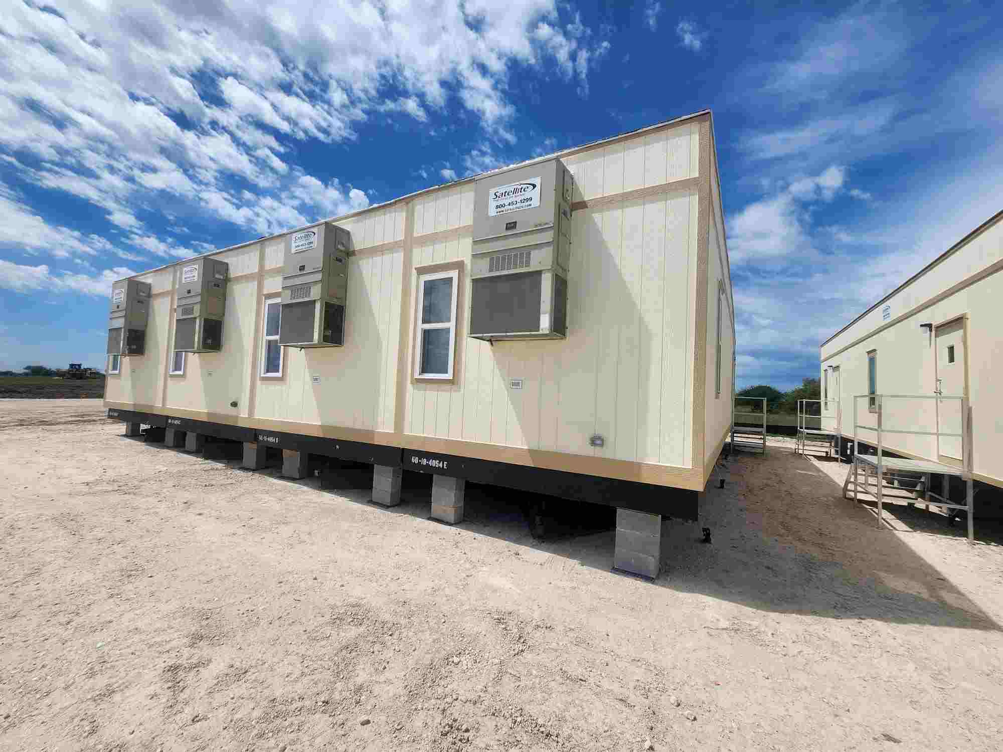 A row of connected construction site modular buildings