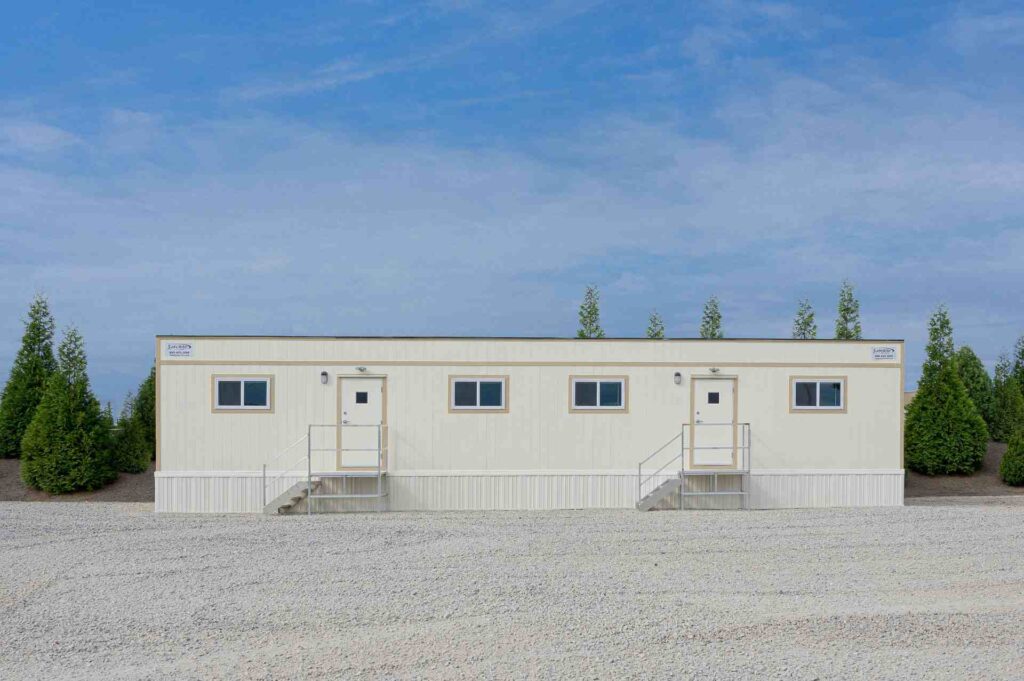 The front of a mobile office trailer on a construction site.