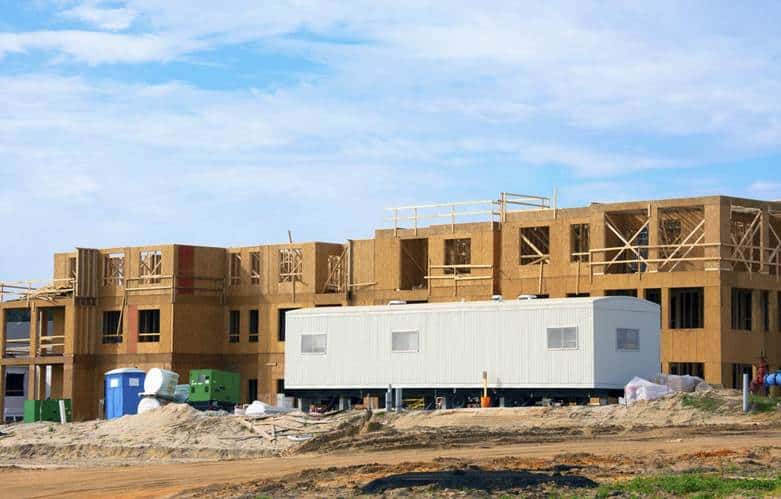 Alt Text: Fully equipped construction office trailers deployed on a remote infrastructure job site.
