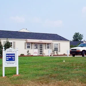 exterior off white building with pitched roof