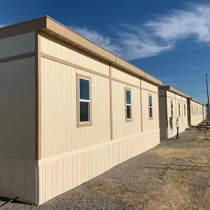 Exterior of attached mobile offices in trailer city at sunset